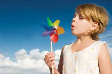 Girl-Blowing-Pinwheel