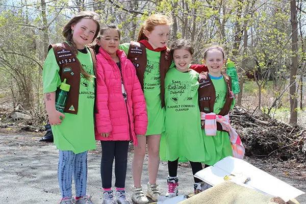 Girl Scouts picking up litter