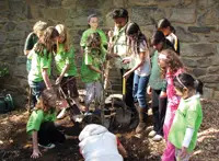 Earth Day; kids celebrating earth day; kids planting a tree; Greenburgh Nature Center