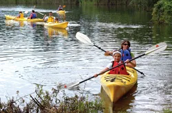family kayaking; mom and son kayak