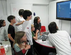Launch Math Achievement Center, NYC; kids learning about math; kids learning on a computer