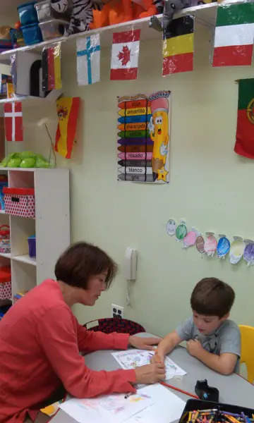 student and teacher in language classroom