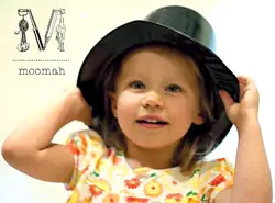 Moomah; little girl wearing a top hat