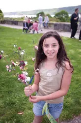 Wave Hill; young girl holding flowers; Mother's Day activities, Bronx