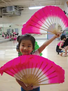 New York Chinese Cultural Center; girl with asian fans, Chinese dance