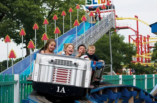 family riding rollercoaster