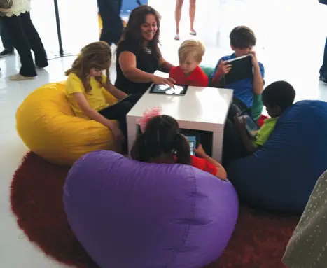 Children playing with the new Reading Rainbow iPad app at its launch