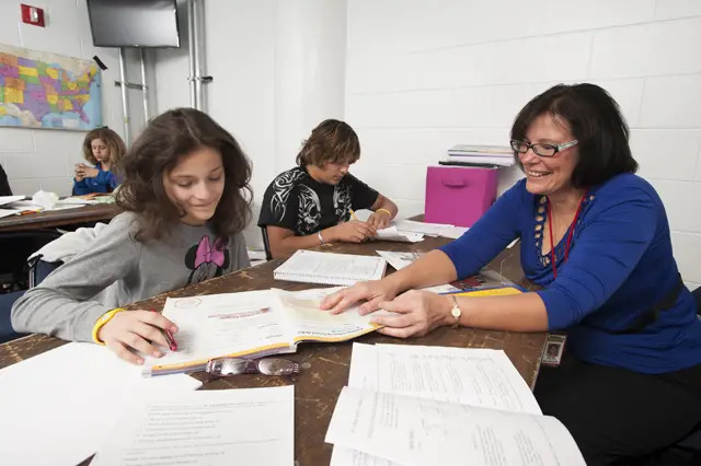 teacher at school teaching student