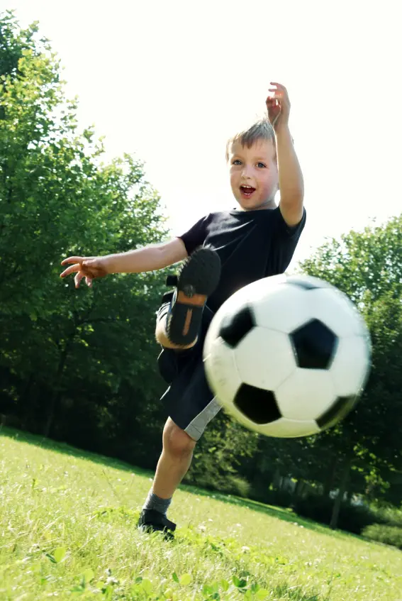 Boy Kicking a Soccer Ball