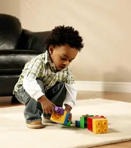 little boy playing with blocks