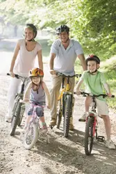 family riding bikes; family bicycle race