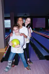 young girls bowling; Strike Out Pediatric Cancer Bowl-A-Thon