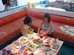 kids doing arts and crafts; two little girls making summer crafts; Surf Craft NY