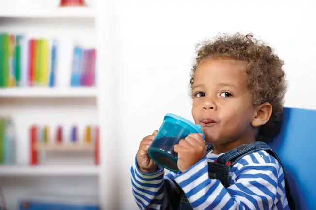 toddler drinking juice