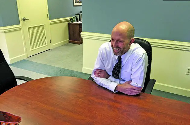 man sitting at desk