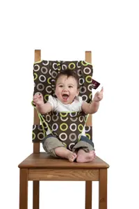 baby sitting in high chair
