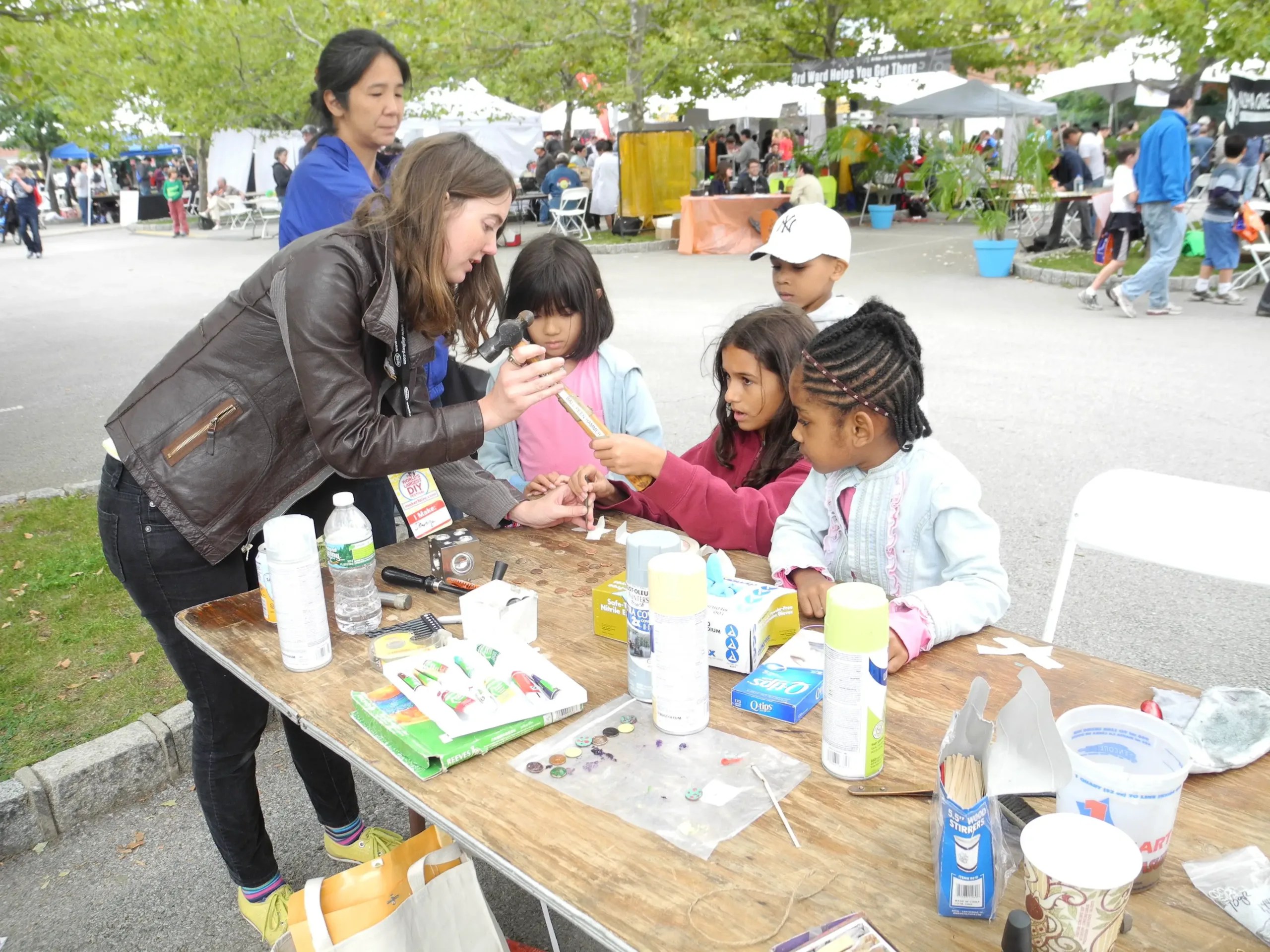 Max Goodman, director of Uproar Art, teaches a jewelry workshop at Maker Faire New York.