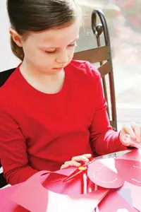 girl making a Valentine's Day card