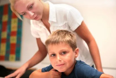 Adult and child in the classroom, teaching