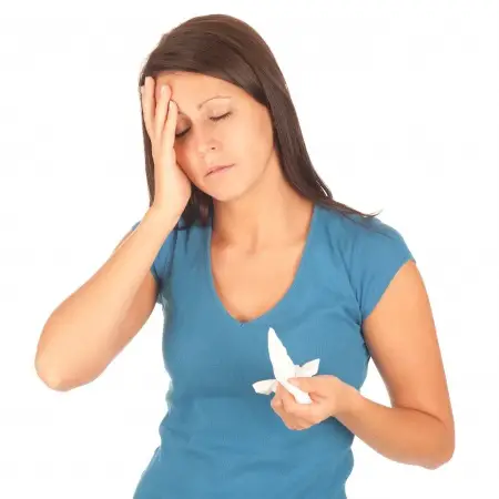 sick adult woman with tissues