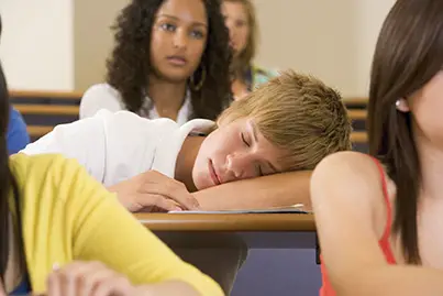 teen asleep in class