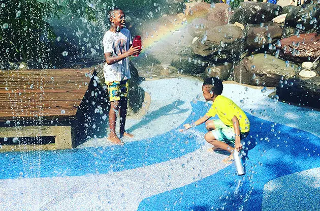 kids playing in sprinklers