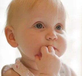 Baby with fingers in mouth