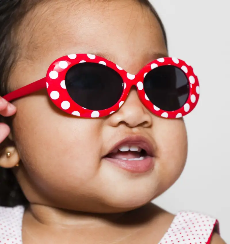 baby wearing red sunglasses