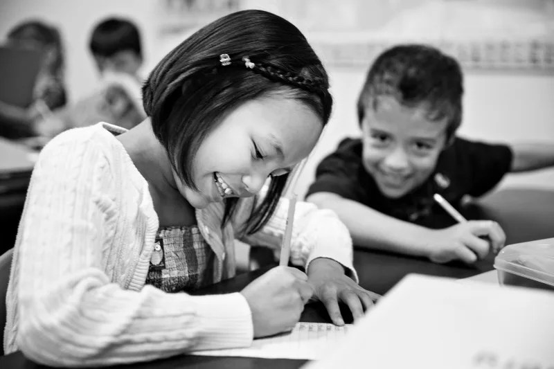 two children working in school