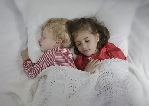 boy and girl toddlers sleeping