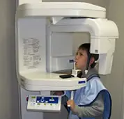 boy at dentist getting a panoramic x-ray