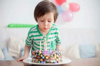 boy-blowing-out-birthday-candles