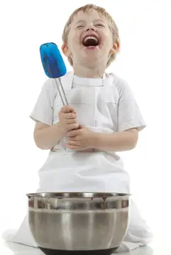 boy cooking and laughing