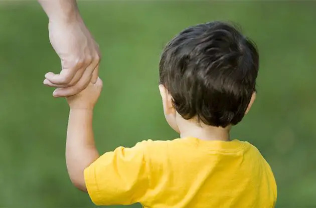 boy holding hand