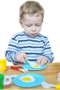 Boy Playing in Kitchen