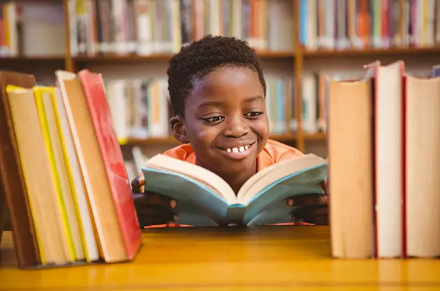 boy studying at library