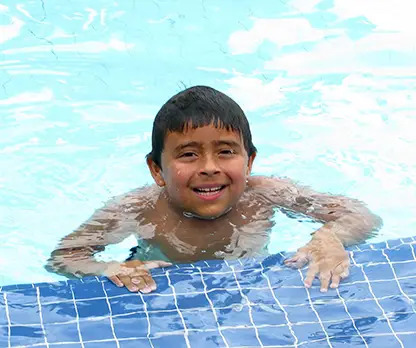 boy swimming in pool