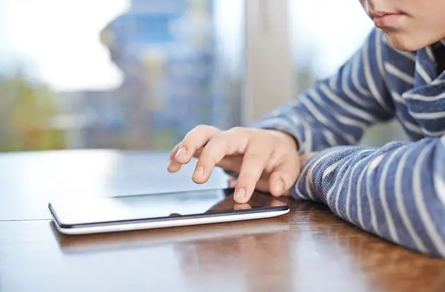 boy using tablet