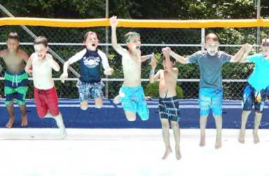boys-jumping-into-swimming-pool