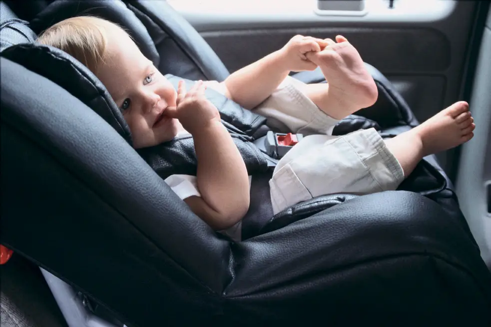 baby buckled into car seat