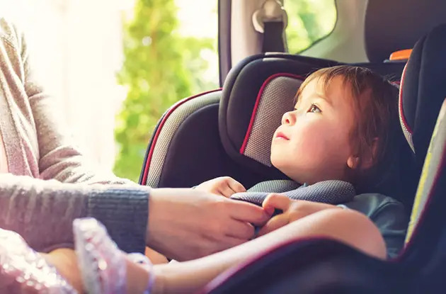 child in a car seat