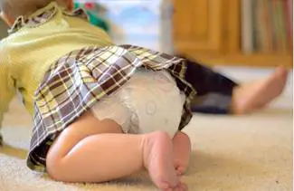 baby girl crawling on the ground 