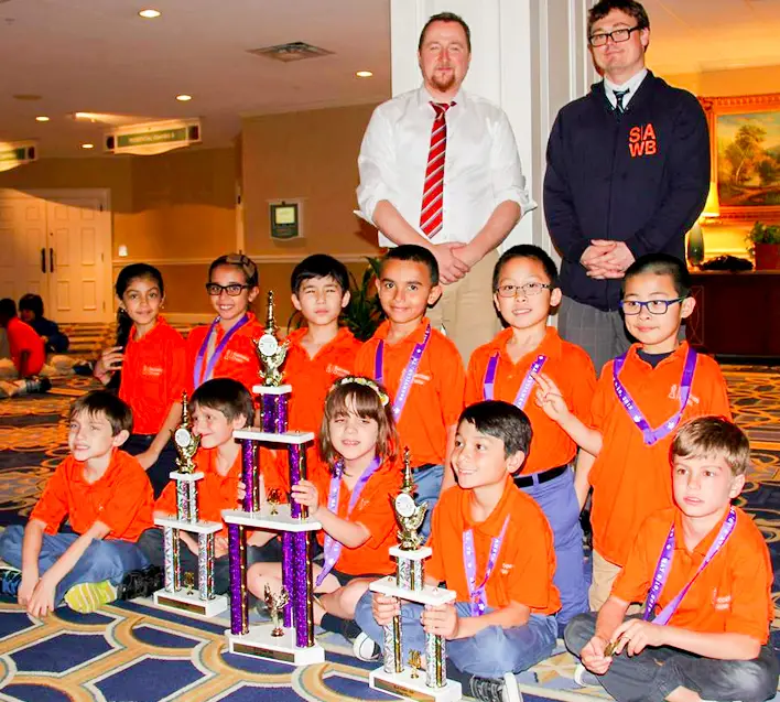 Success Academy Williamsburg chess team with trophies