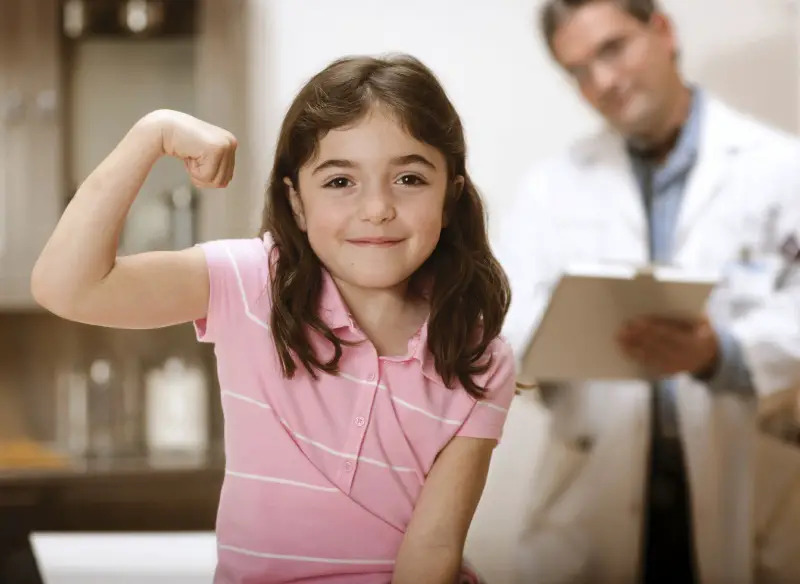 young girl with pediatrician