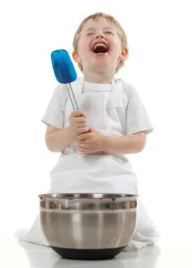 child-laughing-while-cooking