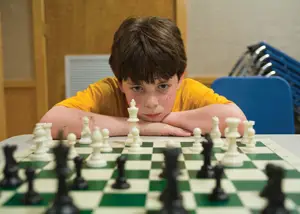 boy playing chess