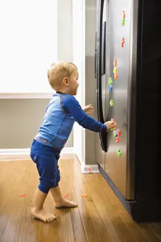 little boy running to refrigerator, freezer; child opening fridge