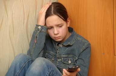 13342367 – the upset girl with a mobile phone