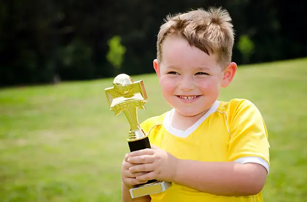 child with trophy