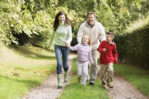 happy family of four on a spring/fall day